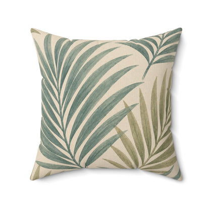 Decorative pillow with green leaf pattern on a beige background