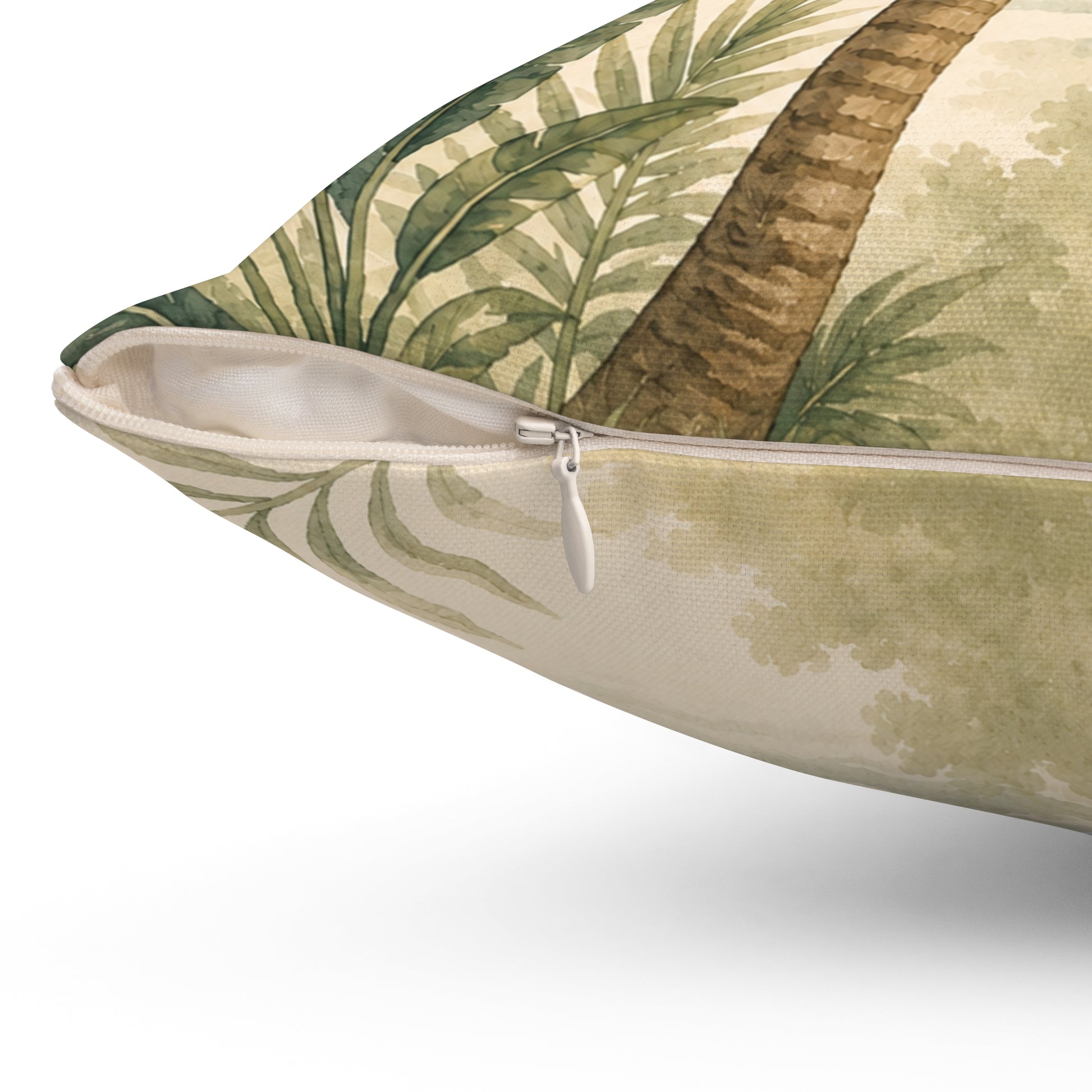 Decorative pillow with tropical leaf pattern on a white background