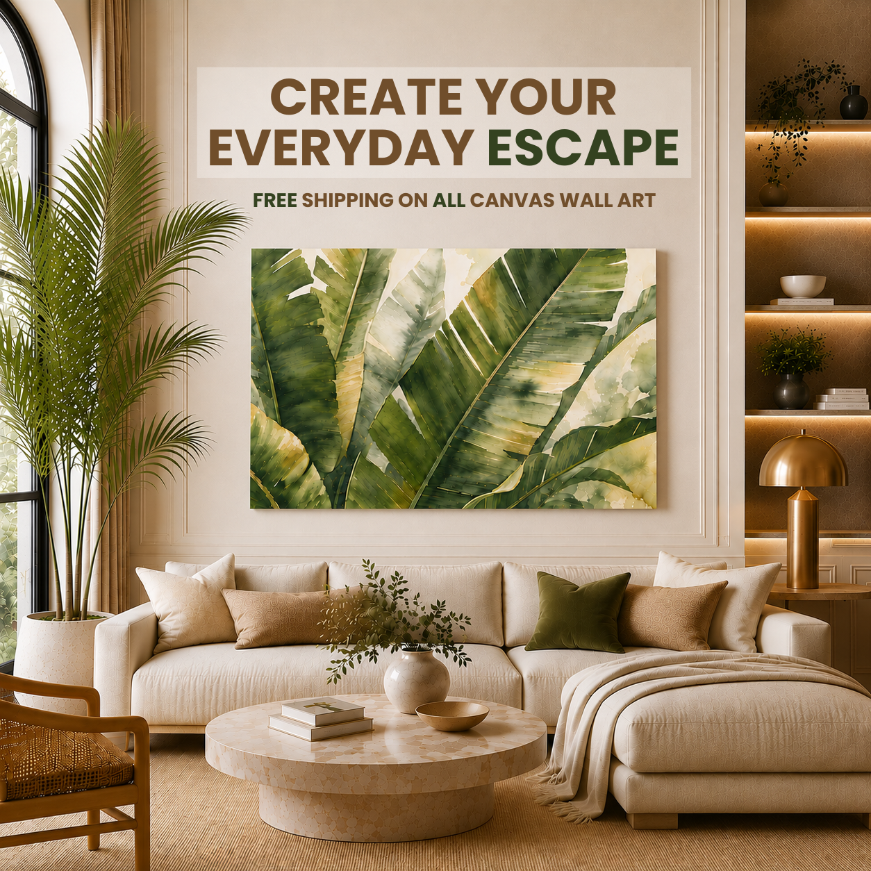 A large rectangular canvas wall art print featuring green tropical banana leaves hangs above a cream sectional sofa in a styled living room. Text above the artwork reads, 'CREATE YOUR EVERYDAY ESCAPE' and 'FREE SHIPPING ON ALL CANVAS WALL ART.